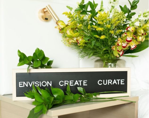 sign with words ENVISION CREATE CURATE